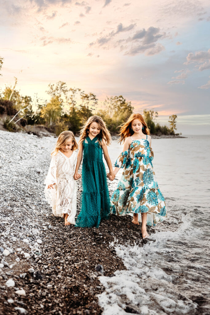 Family Photography, Three little girls holding hands walking on the beach